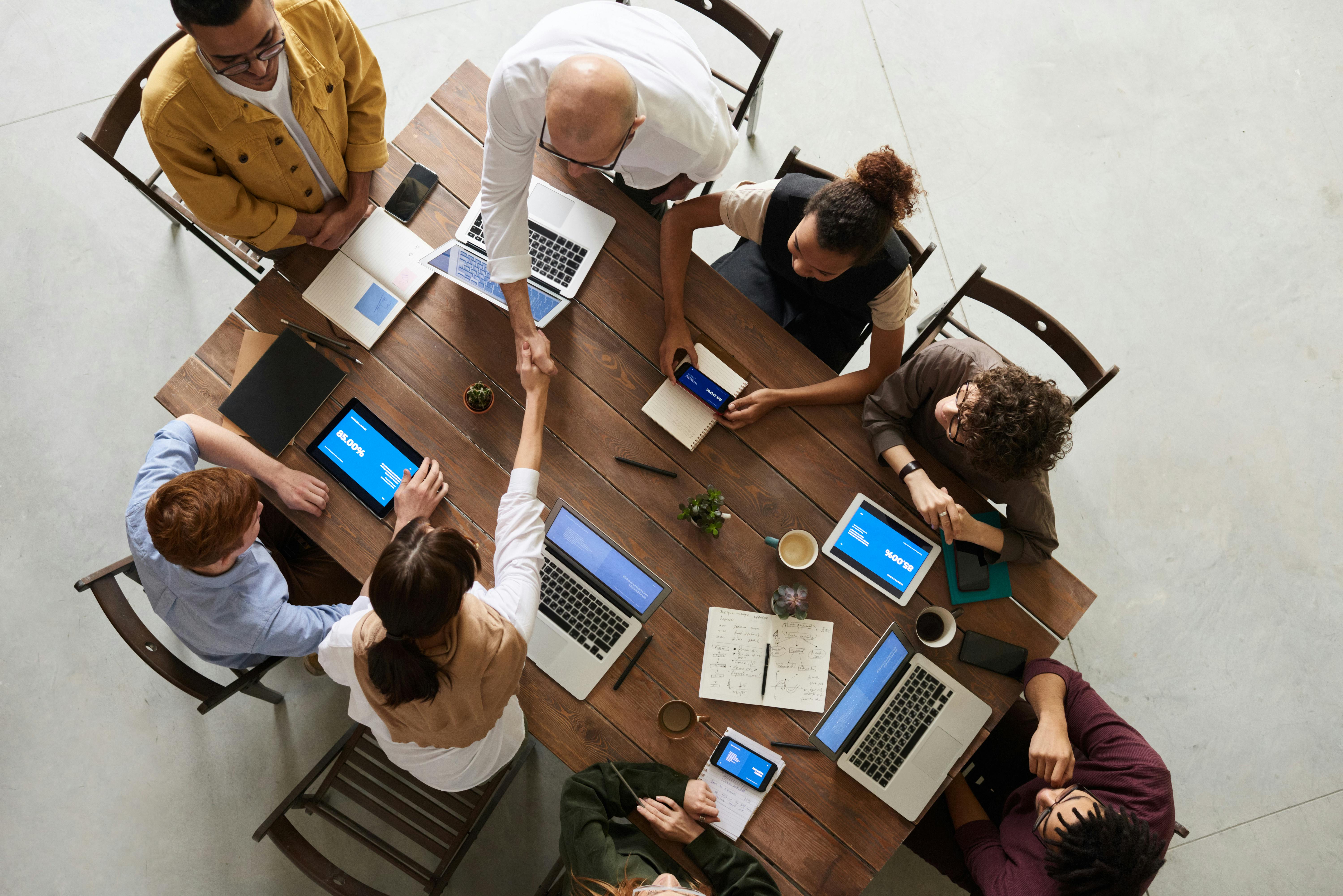 Team working with technology in a modern office, illustrating HubSpot automation success